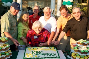 Picture of Phyllis Marcuccio and King Farm Board of Directors with 15th KF Anniversary cake
