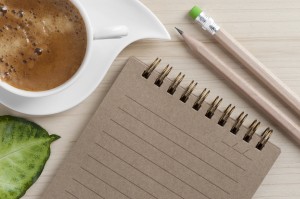 Image of coffee cup and writing pad to represent Creative Connections