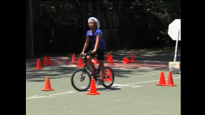 Image of youngster on a bike course at Twiinbrook Day in the Park Celebration