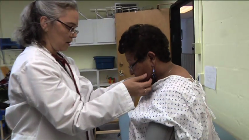 doctor examining patient