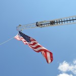 A flag waves in the breeze over the 2012 Agricutural Fair