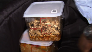 Food in containers to be transported to shelters by Food Recovery Network