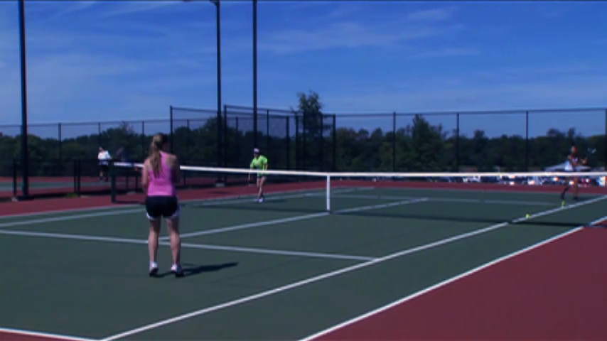 Players on tennis court