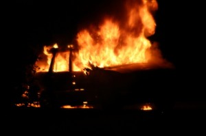 image of burning car at night