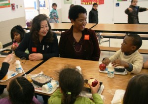 Valerie Ervin and students eating at Roscoe Nix Elementary School