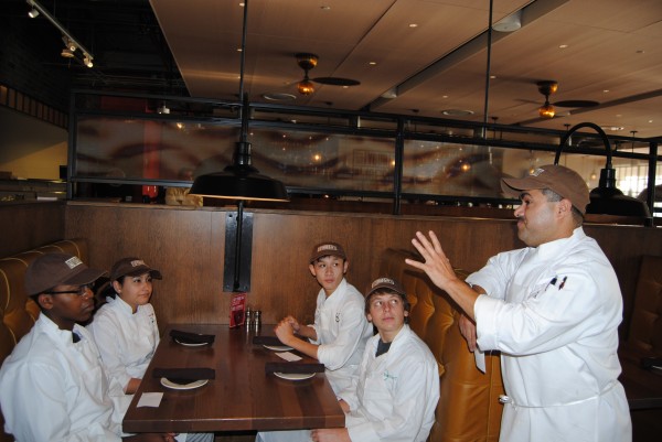 Image of Jose de la Paz, Chef, Not Your Average Joe’s with Quince Orchard High School Students