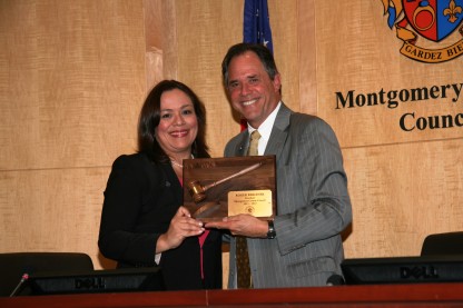 Nancy Navarro presents Roger Berliner with plaque