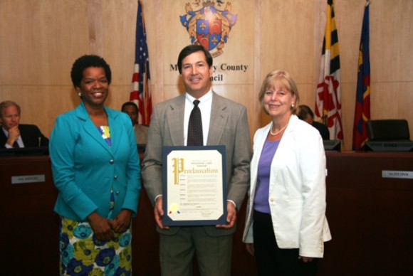 On July 9, Montgomery County Councilmembers Valerie Ervin (left) and Nancy Floreen presented a proclamation on behalf of the Council to Greg Ten Eyck, the director of public affairs and government relations for Safeway, thanking the company for keeping with the County’s environmentally conscious initiatives.