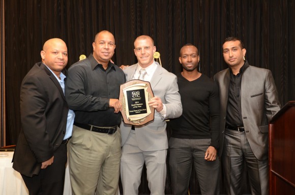 (l:r) Soldierfit’s team of Russel Duval, Geraldo Martin, Owner Dave Posin and Antione Robinson receive the GGCC 7th Annual Small Business of the Year award from prior year recipient Vishal Soni of Authxperts LLC on December 5, 2013.   Photo | John Keith, John Keith Photography 