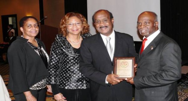 Donald and Mona Williams presented Catherine and Isiah and Leggett the UCF Youth Development Plaque.   