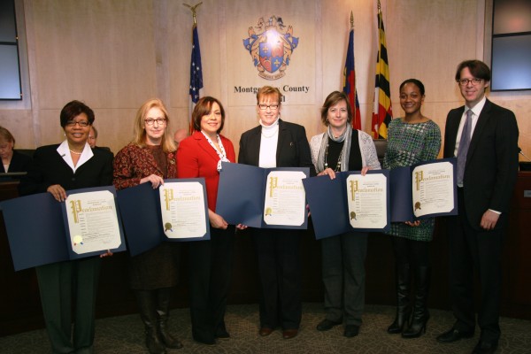 Pam Luckett of Hope Worldwide Mid-Atlantic, Sue Rogan of the Maryland Cash Campaign, Councilmember Nancy Navarro, Denise Fredicks of Stepping Stones, Robin Camille Henry of the Community Action Agency  and Councilmember Hans Riemer.