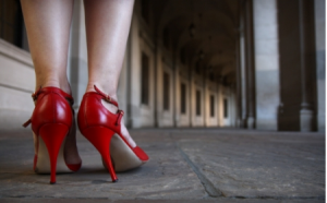 photo of woman's legs in red high heels