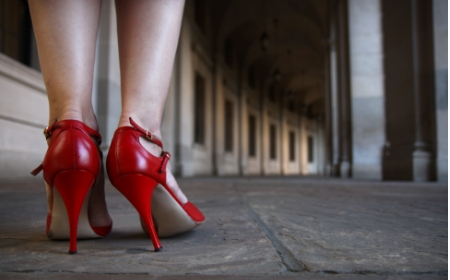 photo of woman's legs in red high heels