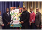 photo county executive ike leggett presenting procalmation to Three Little Birds cast and artistic director