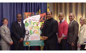 photo county executive ike leggett presenting procalmation to Three Little Birds cast and artistic director