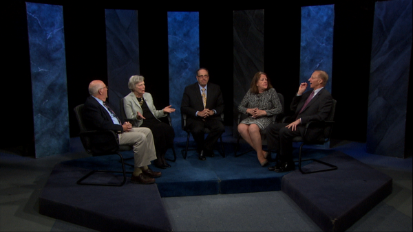 Host Casey Aiken and his panel on the set of "21 This Week." 