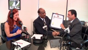 photo county executive ike leggett presenting proclamation to Radio America 1500 AM on Montgomery Al Dia