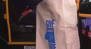 photo of collection bag on bus for Give and Ride food drive