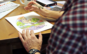 photo of artist working on silver spring egg hunt artwork