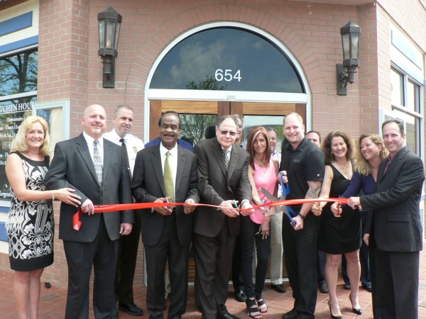 photo of Largent’s Restaurant & Bar Owners Christine D'Amato, Dave D'Amato, Montgomery County Sherriff Darren Popkin, Montgomery County Executive Isiah “Ike” Leggett, City of Gaithersburg Mayor Sidney Katz, and Largent’s Restaurant & Bar Owners Gari Katz, Matt Largent, Sheryl Chiogioji, Jackie Dechter and Larry Dechter cut the ribbon marking the official grand opening of the Kentlands newest neighborhood restaurant and bar on May 2, 2014.(Also in this photo but not visible are City of Gaithersburg Councilmembers Cathy Dryzyzgula, Henry Marraffa and Ryan Spiegel) 