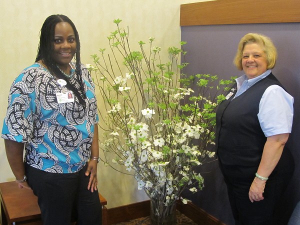 Riderwood, the Erickson Living retirement community, received three bouquets of flowers courtesy of musician and entrepreneur Sean ‘P Diddy’ Combs.  Employees Simone Gomez (left) and Debra Vinh (right) are pictured with one of the bouquets.