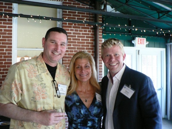 Pepe & Pinky Rodgers, Owners of Pinky & Pepe’s Grape Escape and the wine tasting wine sponsor for the third year in a row, with Nathan Dart, Dart Homes Realty; at the Gaithersburg-Germantown Chamber’s 11th Annual Wine Tasting held at the Kentlands Mansion on May 22, 2014.