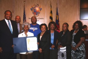 photo of At the ceremonies in Rockville were, left to right: Jim Stowe, director of the County’s Office of Human Rights; Vernon Ricks; Tina Clarke; Arthur Williams; Councilmember Cherri Branson; Janice Freeman; Anita Powell; and Sherlene Lucas.