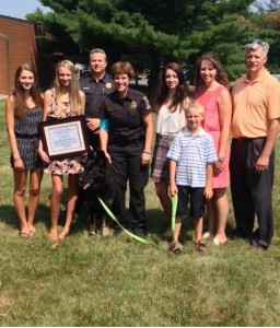 photo of Eva, Commander David Gillespie, Officer Gamard, and Eva’s family