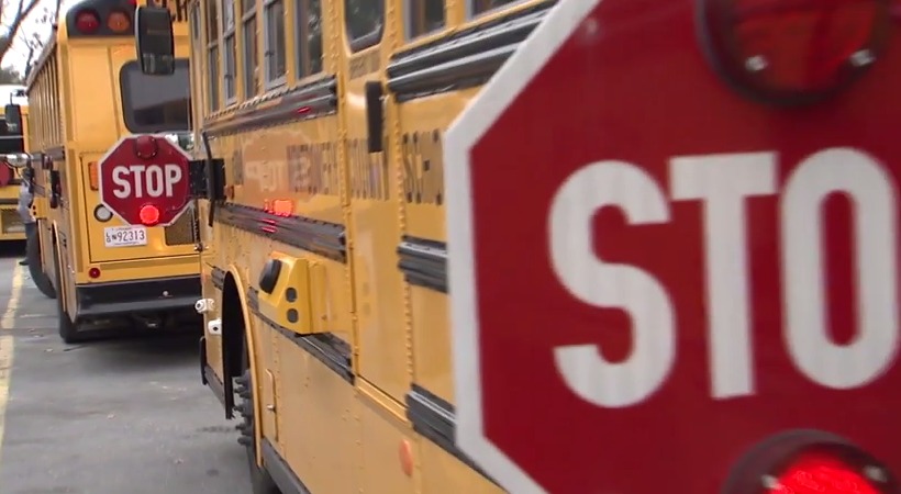 photo of school bus stopped with camera on side