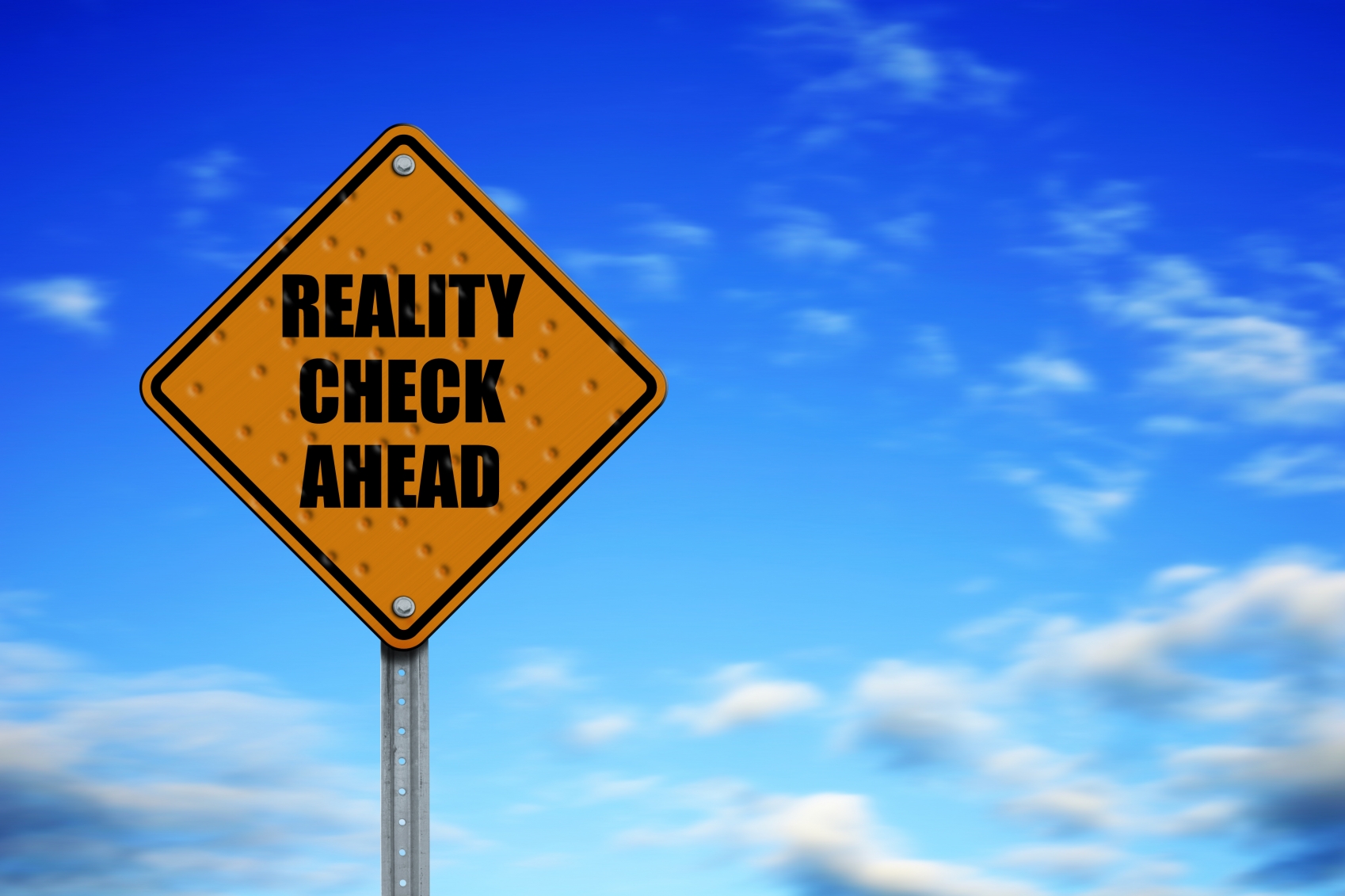 Yellow diamond sign with reality check ahead written on it | Montgomery Community Media