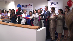 photo of ribbon cutting at new offices for Rockville Economic Development Center and Maryland Women's Business Center