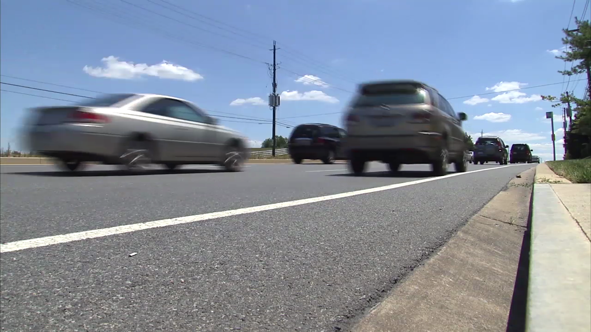 photo of cars on road