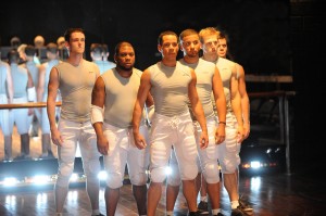 photo of Marcus (Jon Hudson Odom) and the Players await the next play in Olney Theatre Center's production of COLOSSAL
