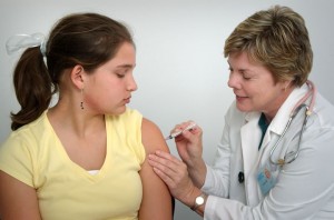 photo of teen receiving immunization