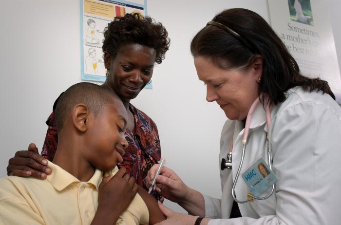 photo of 13 year-old boy receiving immunication