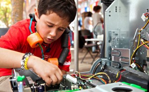 photo of youth working at maker faire
