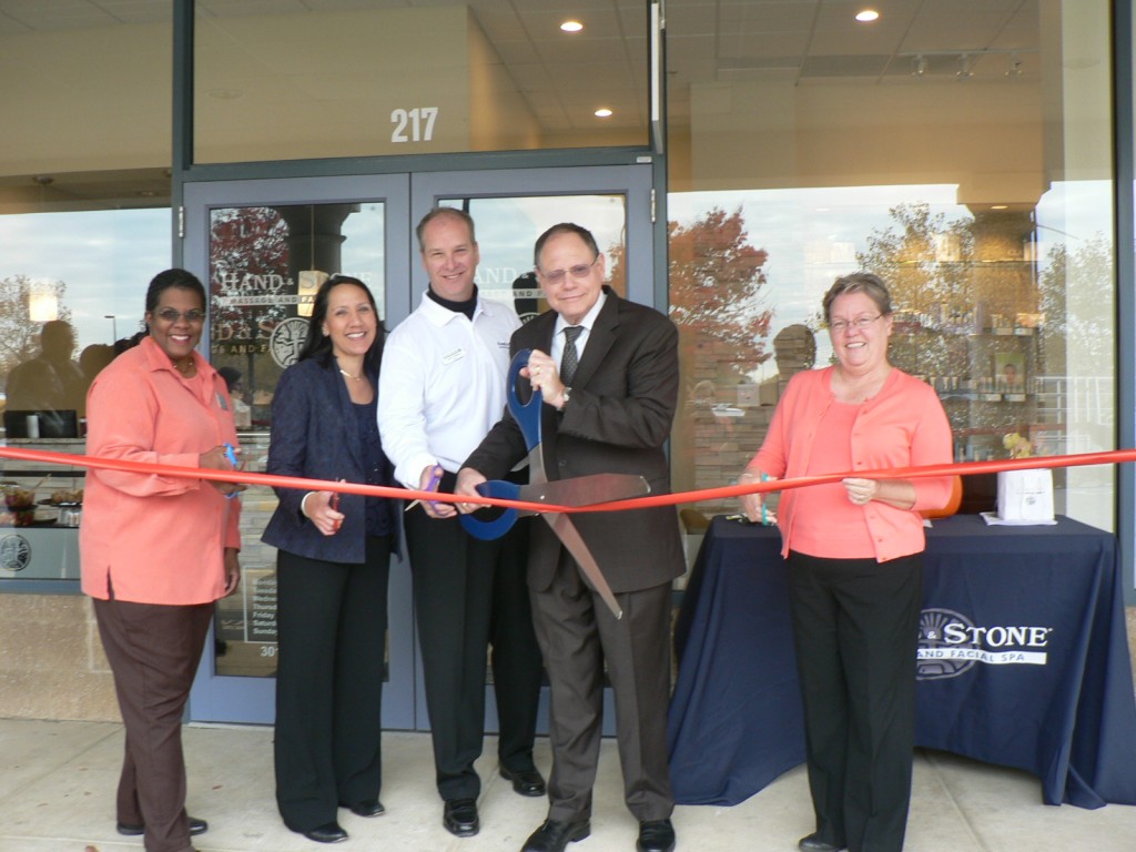 (l:r) Colette Releford, The Gazette and GGCC Board member; Kay Hechler & John Phillips, Hand and Stone Massage and Facial Spa owners; Sidney Katz, City of Gaithersburg Mayor and Cathy Drzyzgula, City of Gaithersburg Councilmember at the Gaithersburg-Germantown Chamber conducted Ribbon Cutting Ceremony for Hand and Stone Massage and Facial Spa on October 31, 2014. (Photo credit – Marilyn Balcombe, GGCC Executive Director)