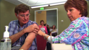 photo of man receiving vaccination