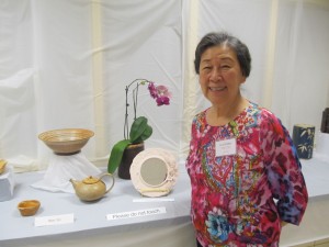 Won Yin, a resident of Riderwood and experienced ceramics teacher, displays her work at the 2nd Annual Art of Ceramics Exhibition in November. 