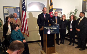 photo of Joshua Starr and Board of Education at press conference following Starr's resignation