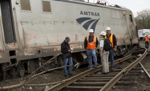 NTSB Recorder Specialist  works with officials on the scene of the Amtrak Train #188 Derailment in Philadelphia