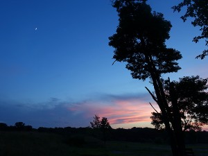 After the June 21 Sunset  with moon in sky at left