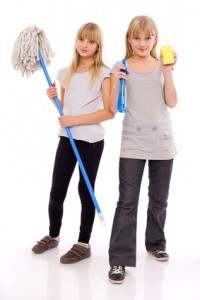 Ready for domestic work - teen girls with cleaning utensils