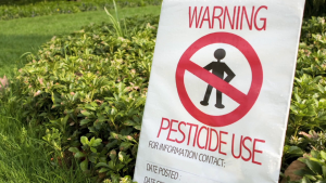 lawn with pesticide use sign