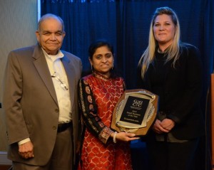 (l:r) Vrajnish Shah & Dipali Shah of ELaunchers.com are presented the Gaithersburg-Germantown Chamber’s 9th Annual Small Business of the Year Award from Kelly Lozano of CFR Engineering at the chamber’s Annual Celebration Dinner on December 3. (Photo Credit: John Keith Photography) 