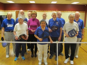 Resident members of the Riderwood Pickleball Group take a moment to have their photo taken with Pirkko Pontinen (pink sweater-middle), a television reporter with the Finnish Broadcasting Company. Ms. Pontinen is a Washington-based correspondent assigned to national stories such as the presidential campaign. 