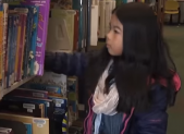 Twinbrook Library Celebrates Grand Reopening After Refresh (VIDEO) Twinbrook Library girl looking at book