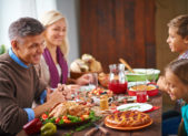 family-at-thanksgiving-dinner-istock-485470786