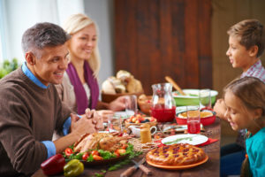 family-at-thanksgiving-dinner-istock-485470786