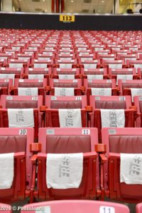 Whiteout Frese Fest towels lay upon the inner bowl seats at the Xfinity Center